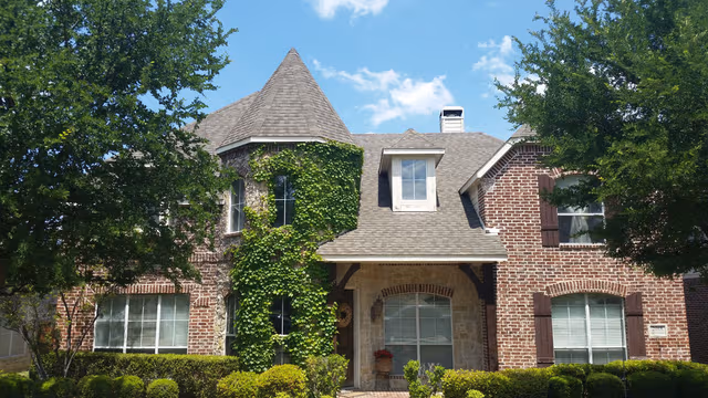 Texas Hammer Roofing team working on a residential roof